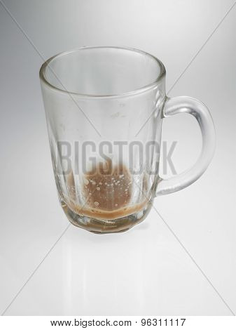 glass with little Tea with milk or Teh Tarik in Malaysia