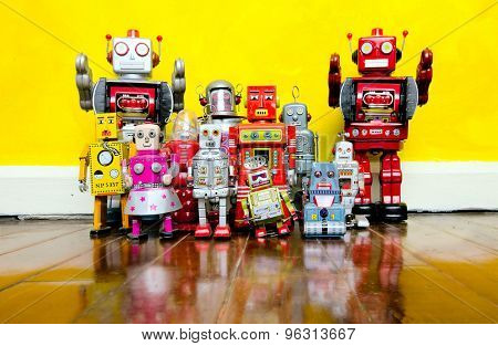 retro robot toys on a wooden floor 