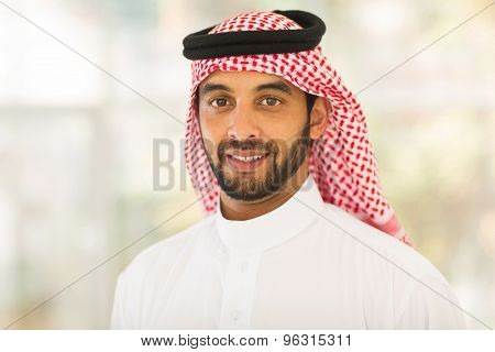 handsome middle eastern man looking at the camera
