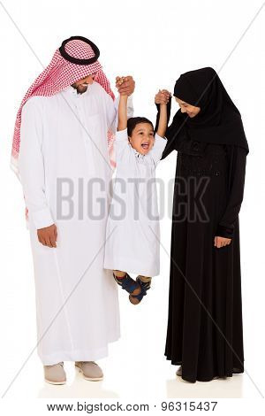 cheerful young muslim family having fun on white background