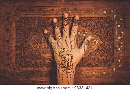 Woman's hand with traditional menhdi henna ornament 