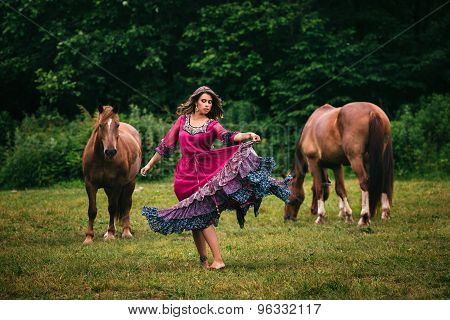 Beautiful gypsy in violet dress