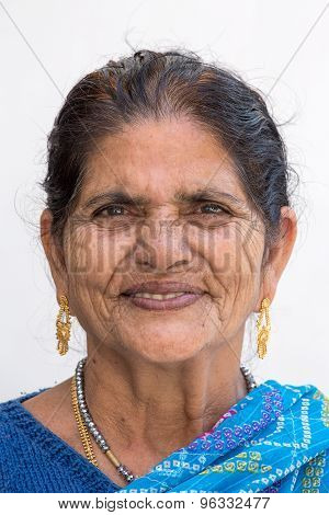 Indian woman visits the sacred river Ganges.