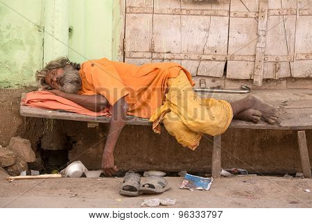 Indian Homeless Man Sleeps On The Street. Pushkar, India