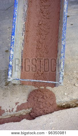 Pouring concrete colored red