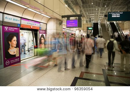 SINGAPORE - CIRCA FEBRUARY, 2015: Passengers at the MRT station in Singapore. MRT is a rapid transit system forming the major component of the railway system in Singapore.