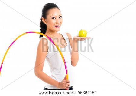 Young Asian woman living healthy and eating fruits