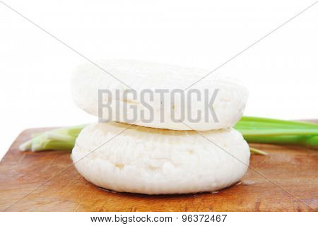 dairy products : feta white cheese on cut board isolated over white background