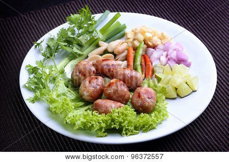 Thai food - East-Northern Thai Grilled Rice Sausages (Fermented sausage) with lime, Chili, Bean, gin