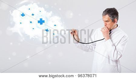 Proffesional doctor listening to abstract cloud with medical signs