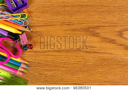 School supplies side border on wood desk