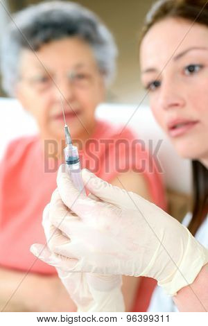 Senior woman getting a flu jab