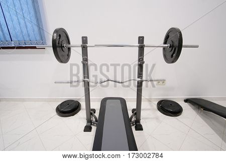 The image of wights in a fitness hall