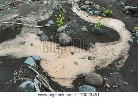 IL and stones on the bottom of river Studenaya. Kamchatka Peninsula.