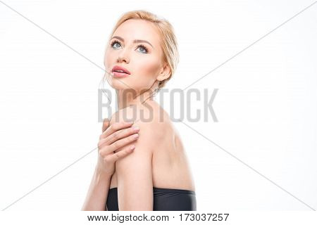 Beautiful sensual blonde woman in swimsuit posing isolated on white skincare concept