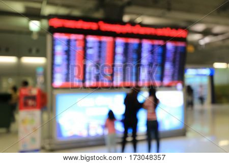 Blurred Image Of Business People In International Airport Terminal, Looking At Information Board, Ch