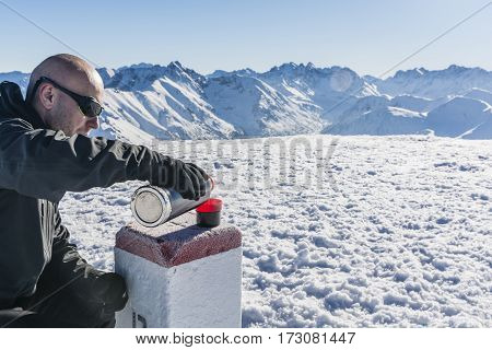 Tourist Pours Hot Tea In The Mountains.
