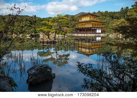 Kinkaku-ji Temple (The Golden Pavilion) and beautiful garden reflected on water one of famous landmarks in Kyoto Japan