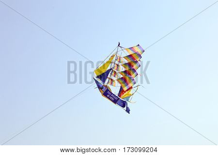 Kite-shaped boat and with rainbow colors on the beach of Bamburi in Kenya