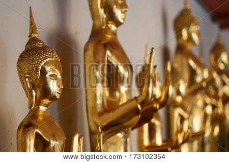 Golden buddha statue on temple Bangkok, Thailand.