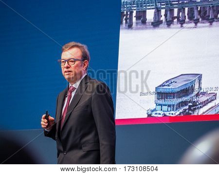MUNICH GERMANY - FEBRUARY 16 2017: Bosch Software Innovations CEO Rainer Kallenbach delivers an address to IBM Genius of Things Summit in Munich Germany on February 16 2017.