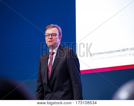 MUNICH GERMANY - FEBRUARY 16 2017: Bosch Software Innovations CEO Rainer Kallenbach delivers an address to IBM Genius of Things Summit in Munich Germany on February 16 2017.