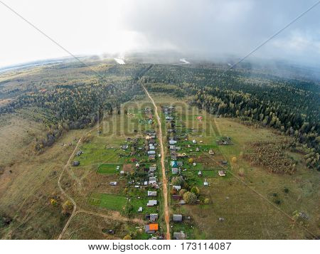 Village in the backwoods of Russia. The view from the top. The village of Khabary one street.