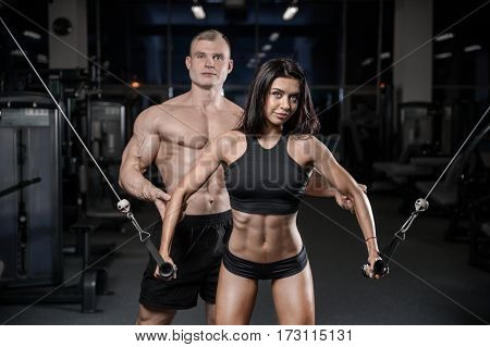 Sexy Caucasian Man And Woman In Gym .