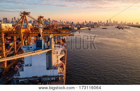 container ship in import export and business logistic.By crane Trade Port Shipping.cargo to harbor.Aerial view.Water transport.International.Shell Marine.Top view.