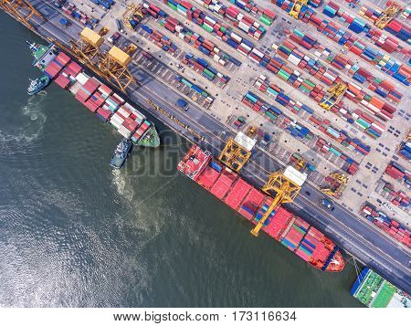 container ship in import export and business logistic.By crane Trade Port Shipping.cargo to harbor.Aerial view.Water transport.International.Shell Marine.Top view.