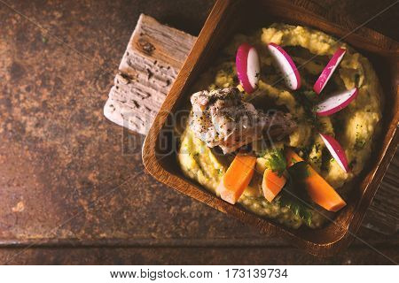 Salad of beans, chicken, carrots, radishes in a bowl copy space horizontal