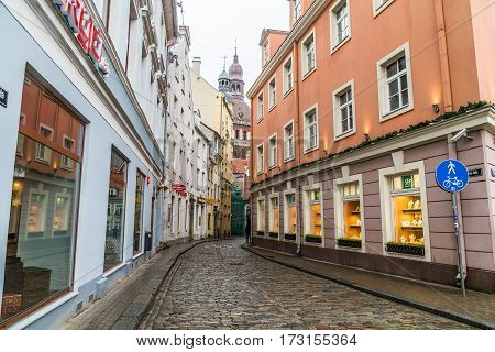 RIGA LATVIA - 1ST JAN 2017: A view along streets in Old Town Riga towards the Riga Dome Cathedral at during the day.