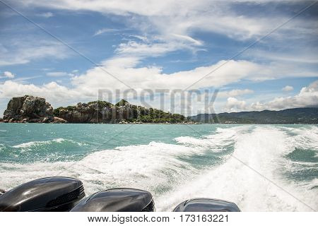 speed boat motor water wave Beautiful rock and sea with blue sky in Koh Samui Thailand