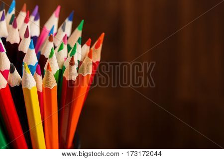 Color pencils on wood background close up , Color pencils Background texture. Bunch of colorful pencils. Place for the text. Eucation, art, design. Painting and drawing.