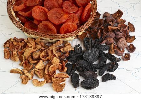Dried fruits assortment on white background heaps