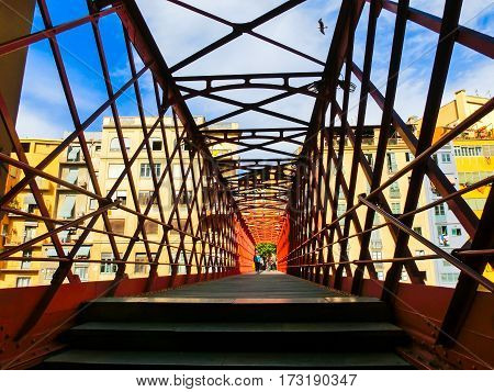 Iron bridge and coloured houses in Girona, Spain