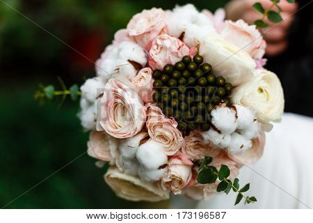 Beautiful Winter Wedding Bouquet With Cones, Cotton And Spruce Branches. Bride Holding A Bridal Bouq
