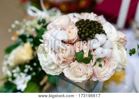 Beautiful Winter Wedding Bouquet With Cones, Cotton And Spruce Branches. Bride Holding A Bridal Bouq