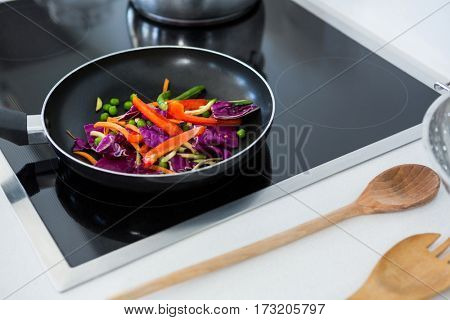 Food on a induction cooktop in kitchen at home