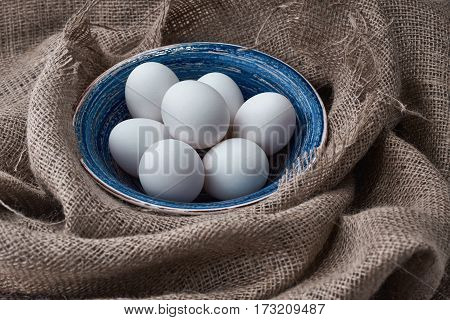 Ecological natural fresh eggs collected in the plate for cooking