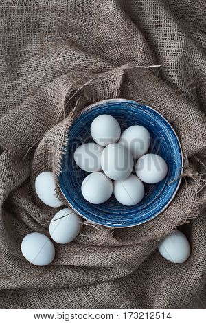 Ecological natural fresh eggs collected in the plate for cooking