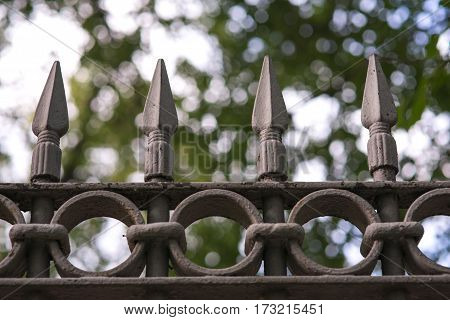 black metal fencing with a sharpen spear tip top.