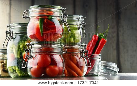 Jars With Marinated Food And Organic Raw Vegetables