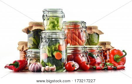 Jars With Marinated Food And Raw Vegetables Isolated On White