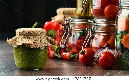 Jars With Marinated Food And Organic Raw Vegetables