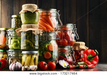 Jars With Marinated Food And Organic Raw Vegetables
