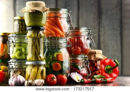 Jars With Marinated Food And Organic Raw Vegetables