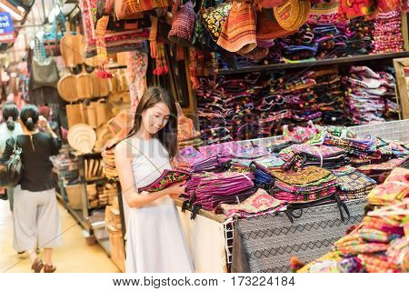 asian young woman traveling and shopping at Chatuchak weekend market, Bangkok, Thailand