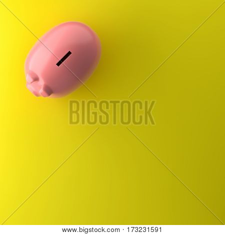 TOP VIEW OF PIGGY BANK ON YELLOW BACKGROUND