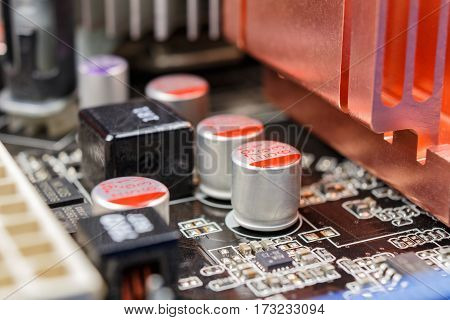 Electrolytic capacitors installed on the motherboard closeup